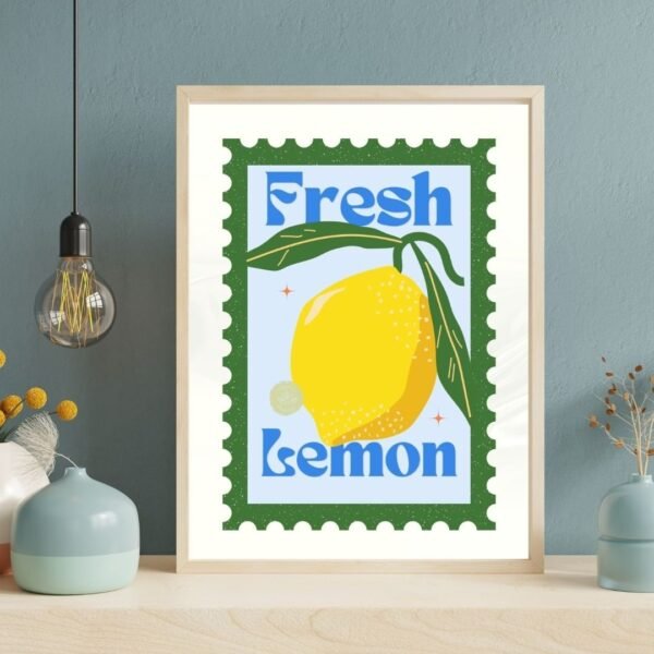 A Fresh Lemon framed poster showcases a stylized bright yellow lemon with green leaves on a green background. Bold blue letters spell out Fresh Lemon. Its displayed on a shelf alongside decorative vases and an overhead hanging light bulb.