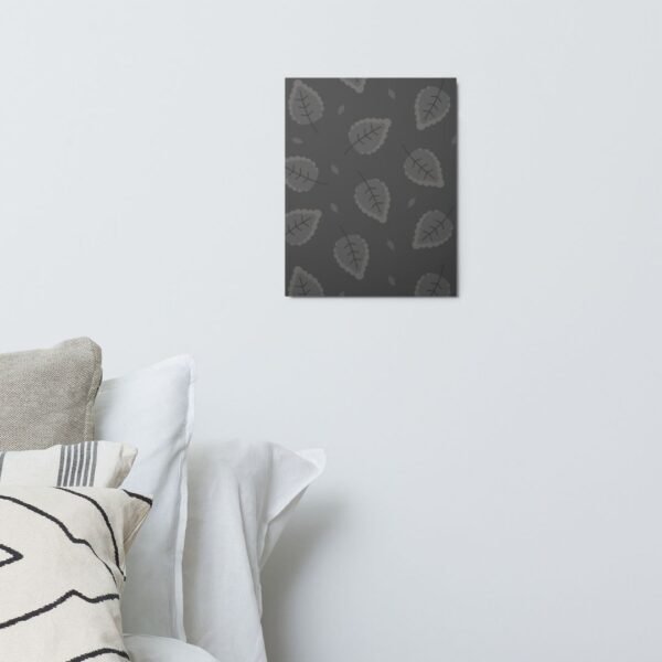 Dark-themed metal print with repeating stylized grey leaf pattern on charcoal background