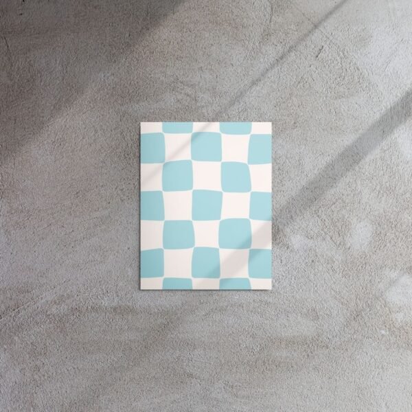 metal print showcasing an elegant sky blue and white tile motif with repeating shapes on a sleek surface.