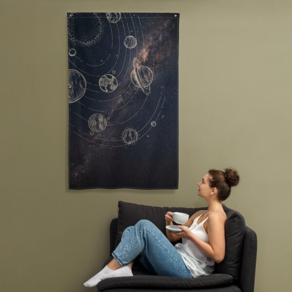 Wall hanging featuring a design of celestial bodies and the Milky Way galaxy.