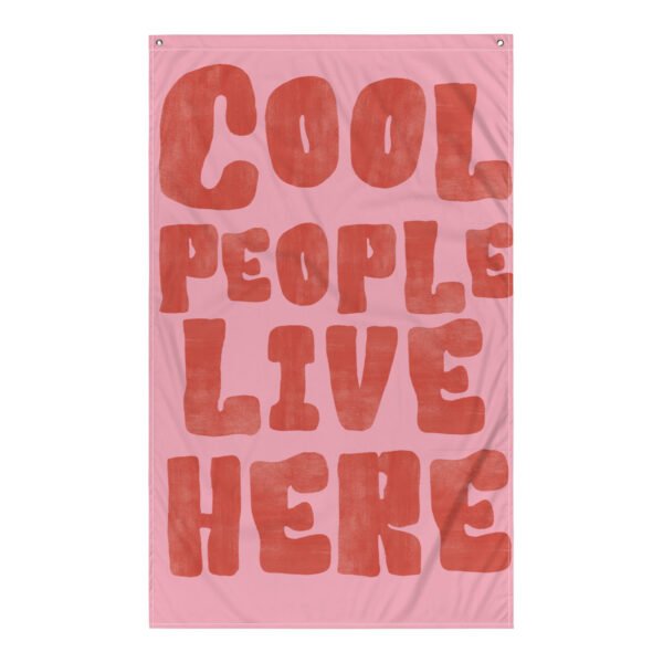 tapestry wall hanging featuring the phrase 'Cool People Live Here' in bold red letters on a pink background.