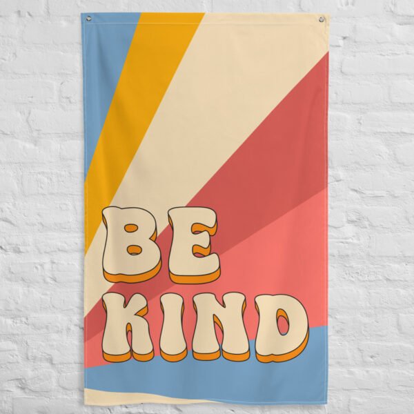 tapestry wall hanging featuring the phrase 'Be Kind' in bold letters with a colorful background.