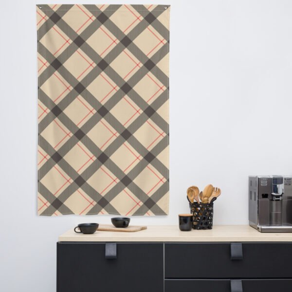 Beige and gray plaid design printed on fabric, wall hanging on a wall in a kitchen setting.