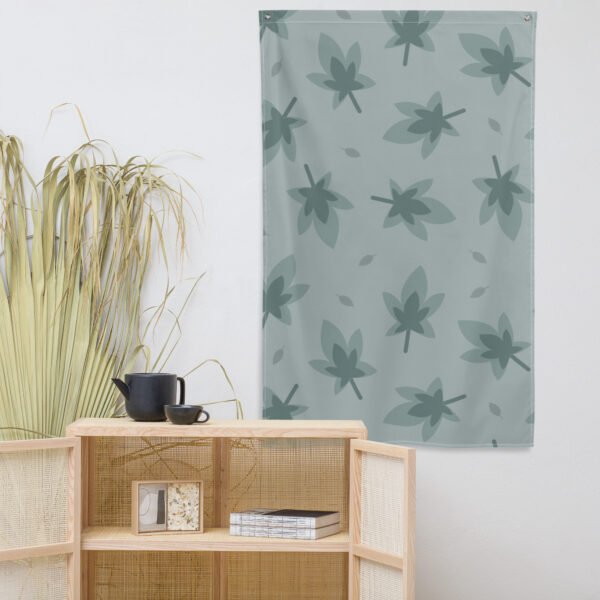 tapestry Wall hanging featuring a leaf pattern in muted green tones against a light background.
