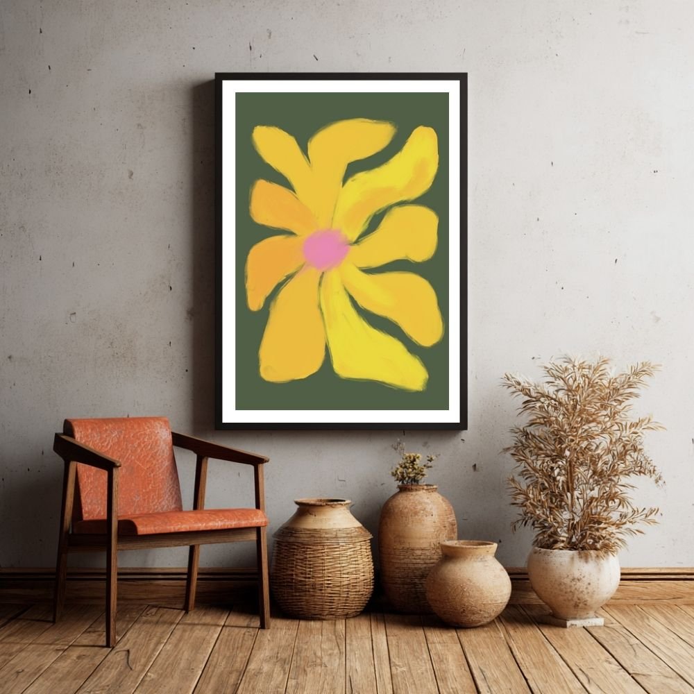 Framed artwork of a yellow flower on a dark green background, displayed on a wall.