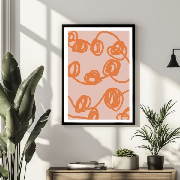 Framed abstract line art print featuring orange loops on a pink background.