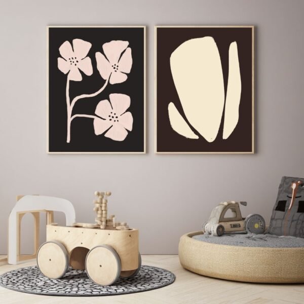 Two framed art prints featuring floral designs and abstract shapes on a wall.