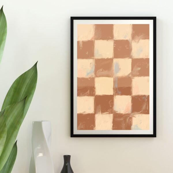 Framed abstract checkerboard artwork in warm tones displayed on a wall.