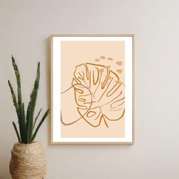 Minimalistic monstera leaf wall art hanging on a wall in a contemporary home setting