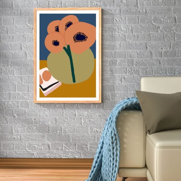 Framed abstract floral artwork featuring round shapes and muted colors displayed on a wall.