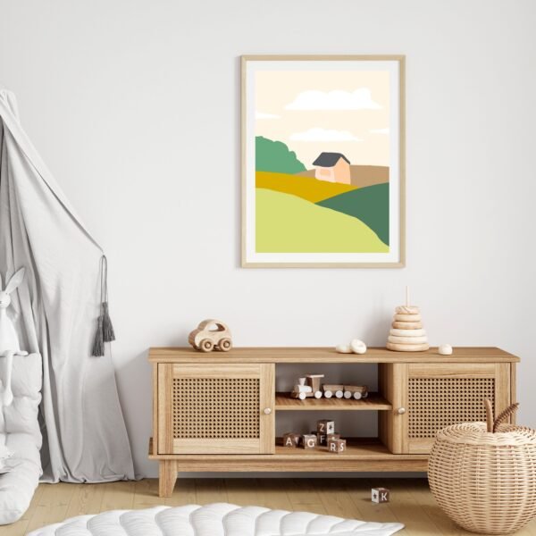 Peaceful countryside wall art with gentle colors and soft clouds hanging above desk with brown frame