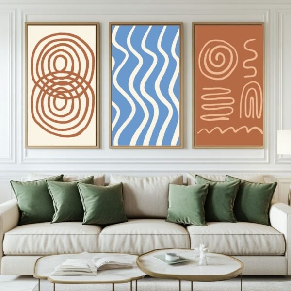 Three framed abstract art prints featuring various patterns and colors displayed above a sofa.