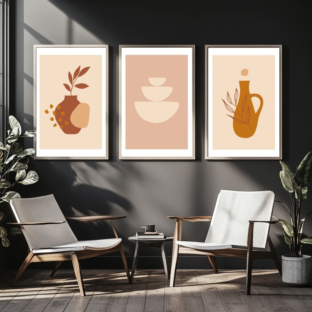 Set of three framed abstract prints with vases and warm-colored shapes.