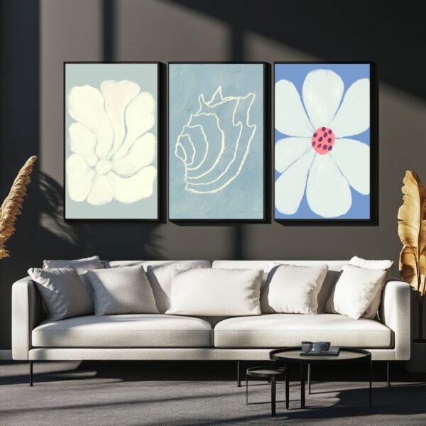 Set of three framed abstract floral art prints in soft colors.