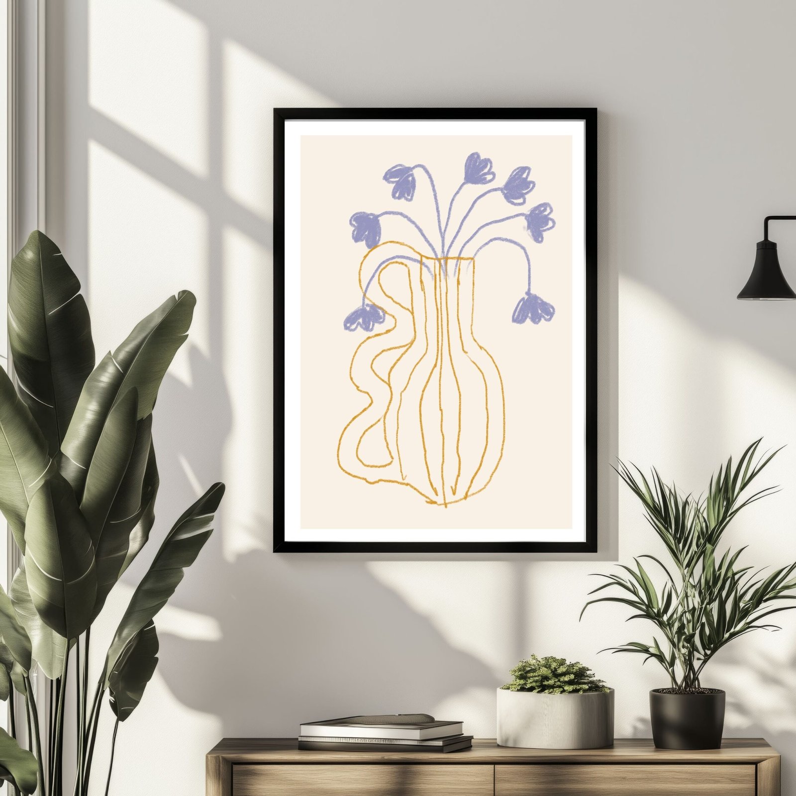 Framed artwork depicting a vase with bluebell flowers in a minimalist style.