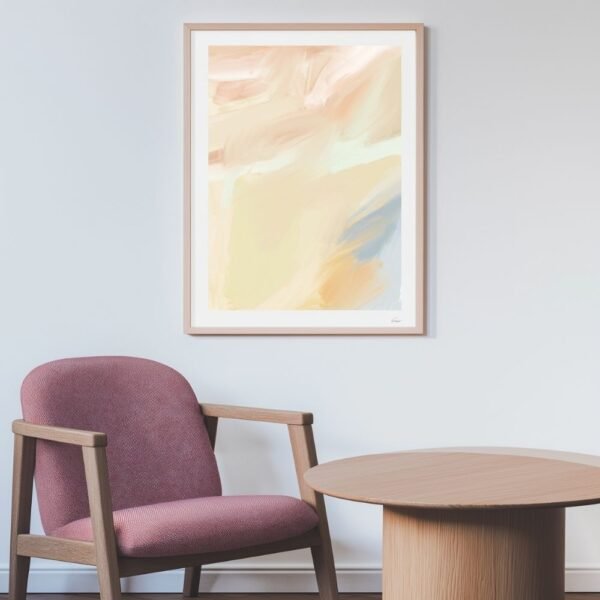 Abstract artwork featuring soft pastel colors displayed in a wooden frame on a wall.