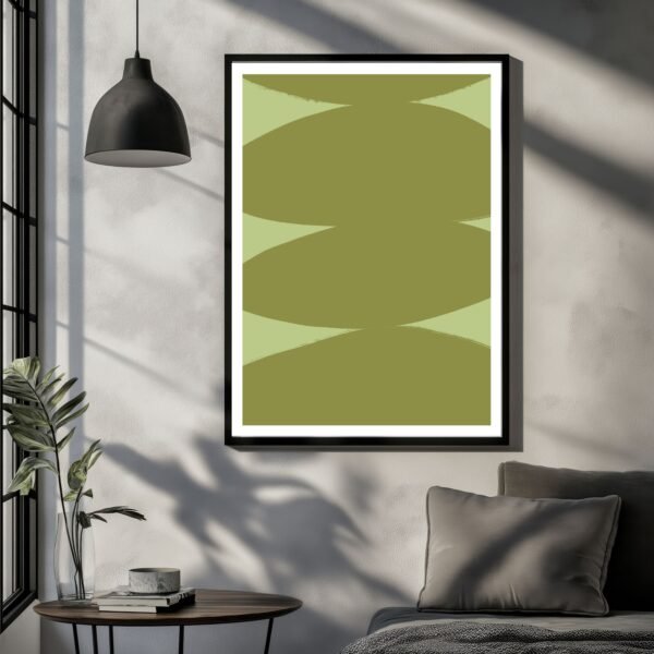 Framed abstract artwork featuring green shapes on a light background.
