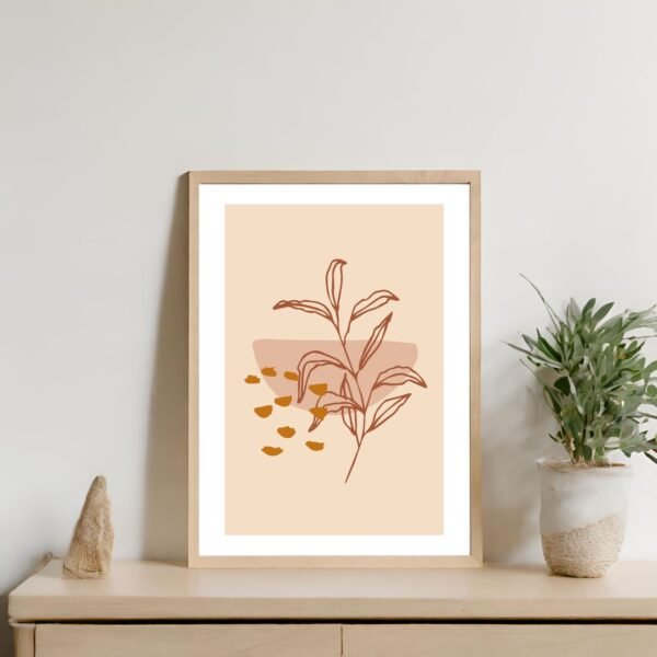 Framed artwork featuring a plant illustration on a beige background with abstract shapes.