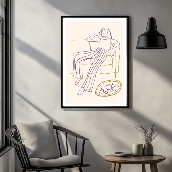 Framed line art depicting a person sitting on a couch with a plate of food nearby.