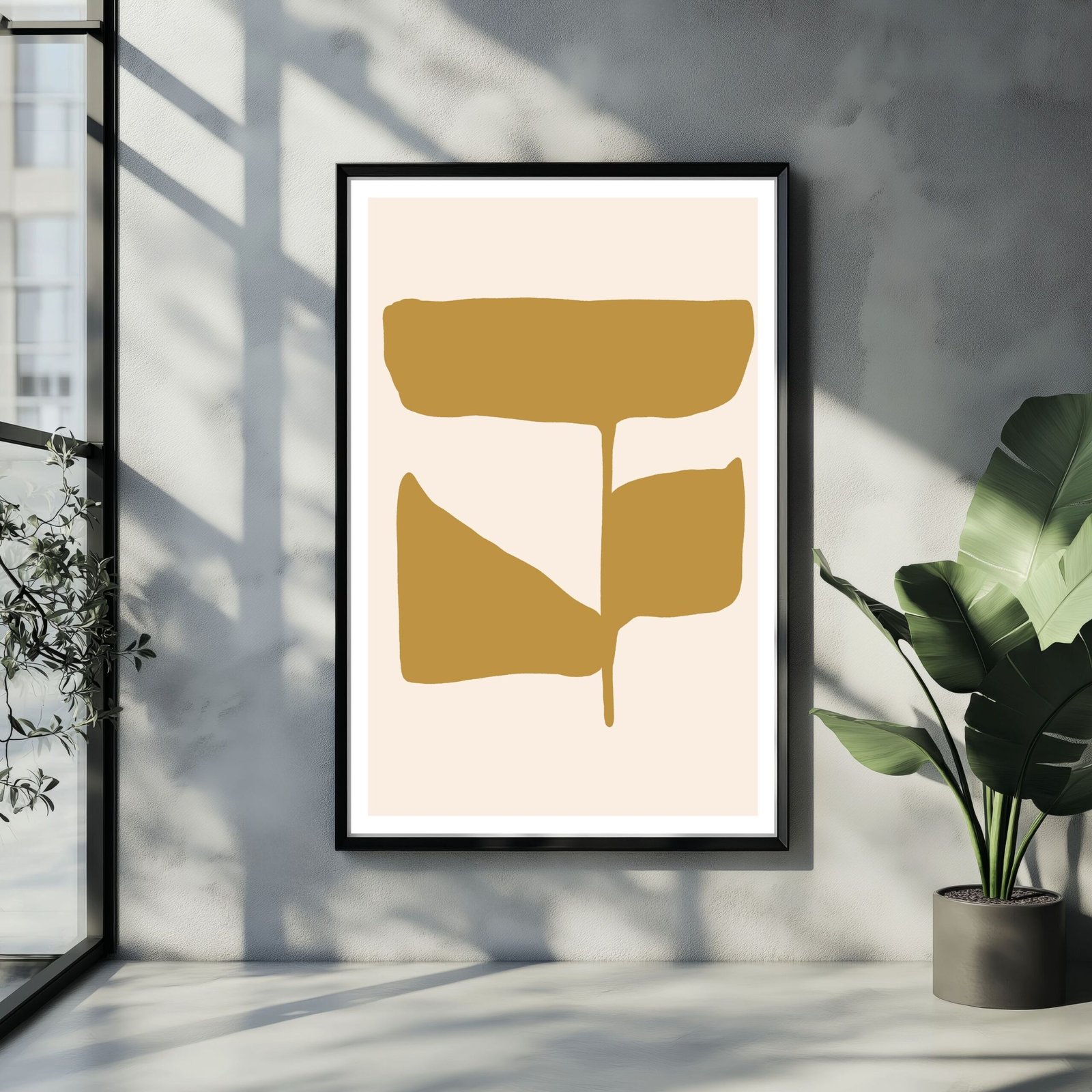 Abstract artwork featuring gold shapes on a beige background within a black frame.