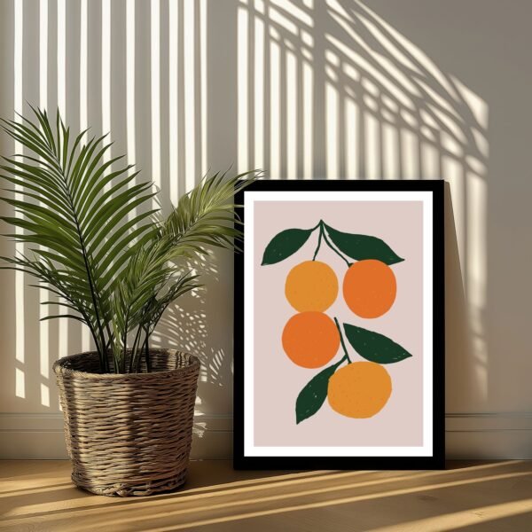 Framed artwork featuring three oranges with green leaves on a light background.