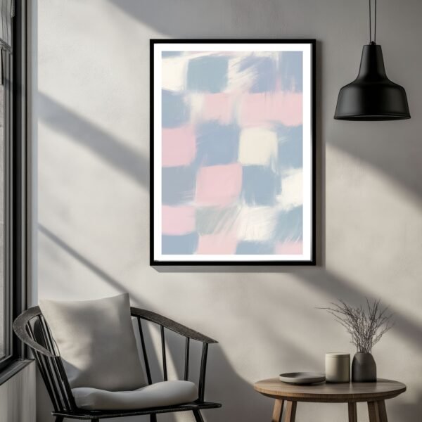Framed abstract artwork featuring soft pastel colors in a grid pattern on a wall.