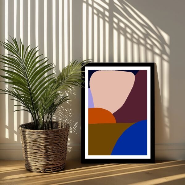 Framed abstract artwork featuring geometric shapes in various colors next to a potted plant.